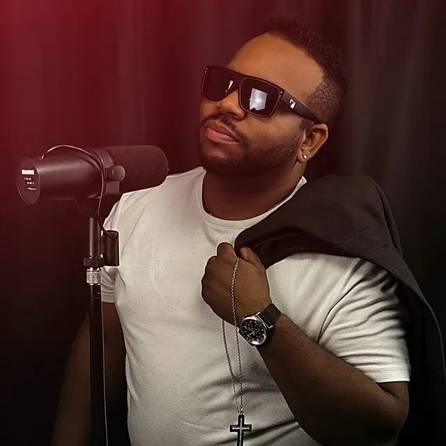 Eutoine in the studio beside a microphone